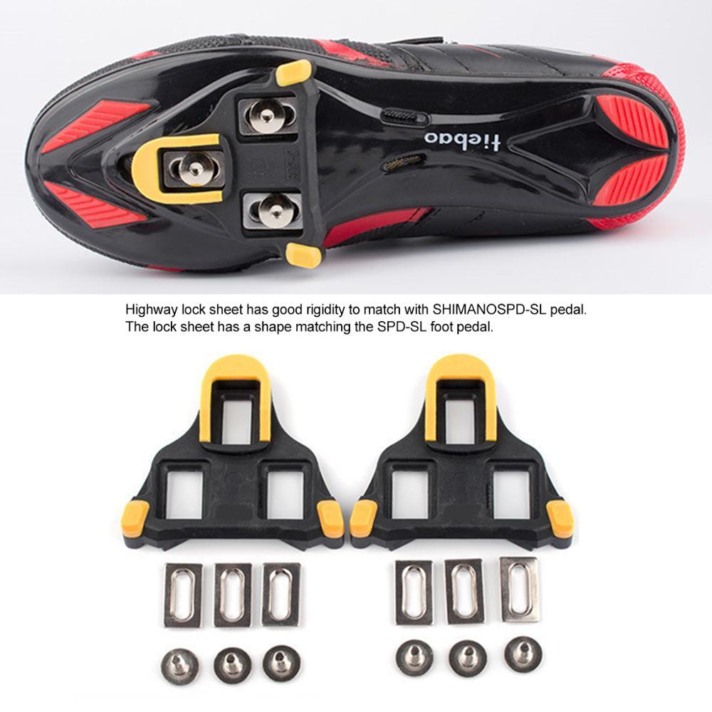 Cycling cleats with lock sheet and screws on a white background
